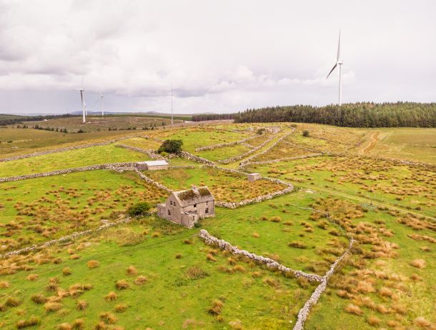 Irish house with landscape and wind turbines